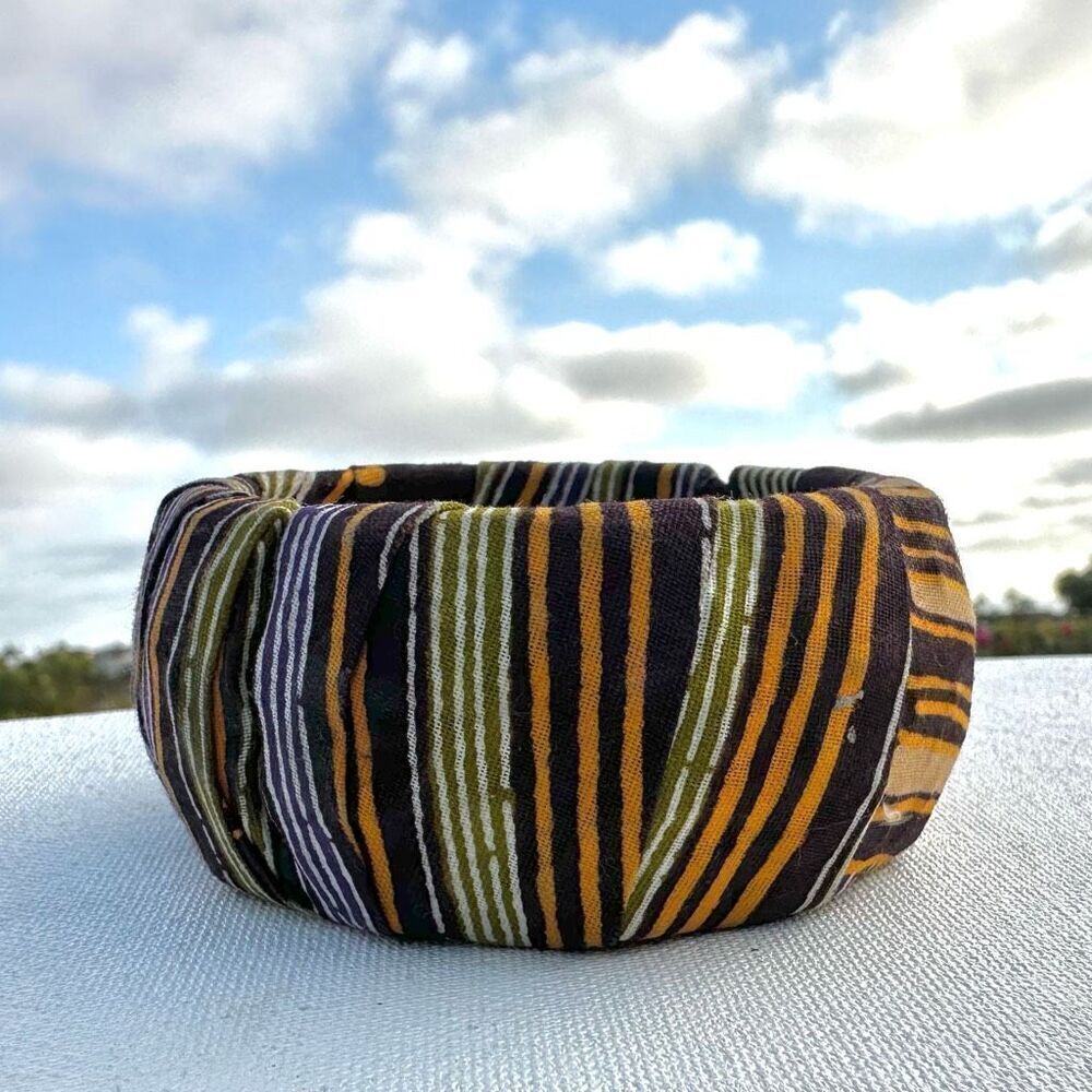 Fabric covered wide bangle bracelet